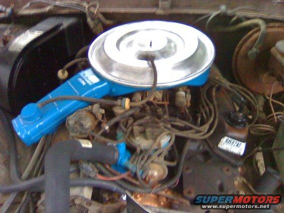 Engine bay with chrome air cleaner and blue component
