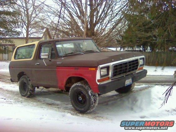 Ford Bronco with brown and red paint, parked in snow