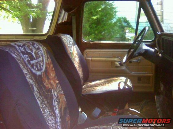 1979 Ford Bronco interior showing camouflage seat covers on front seats and dashboard details