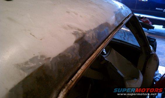 This is surface rust along passenger side drip rail.  There is a some pitting.