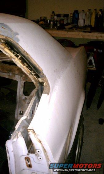 Driver side quarter panel.  Sorry for the bad angle its about a foot from the wall.

I havent ground into it any so I am not sure if there is rust on it.