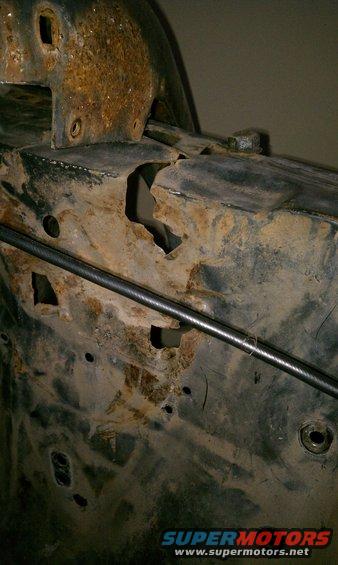 imag0112.jpg Driver side inner fender.  This is the panel between the shock tower and the firewall.  Here you can see why it needs to be replaced.  I do have the replacement panel for this.