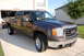 2007 GMC Sierra 1500 - Front 3/4 view of a brown 2007 GMC Sierra 1500 pickup truck.