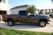 2007 GMC Sierra 1500 - This gray 2007 GMC Sierra 1500 pickup truck is parked in a suburban driveway on a sunny day.