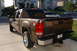 2007 GMC Sierra 1500 - This 2007 GMC Sierra 1500 pickup truck is seen from the rear 3/4 angle in a driveway.
