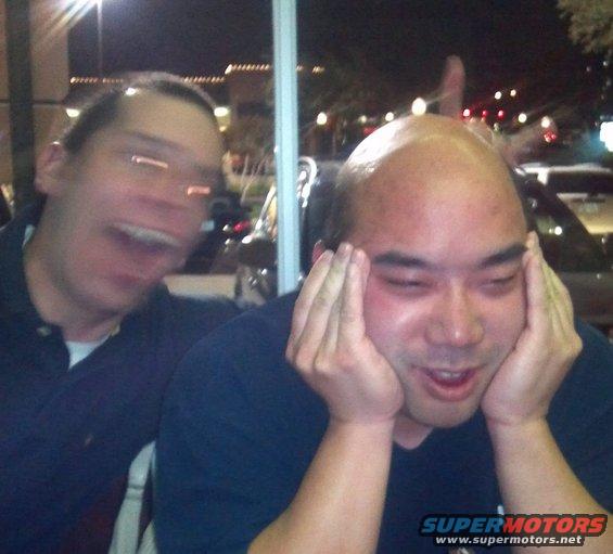 Two men making faces, one with hands on cheeks, the other with mouth open