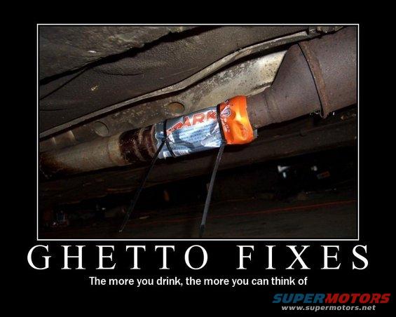 Underneath a car, an exhaust pipe is temporarily fixed with a candy bar and zip ties