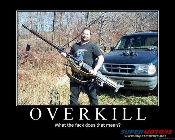 Guy with a huge gun standing by a Ford Explorer