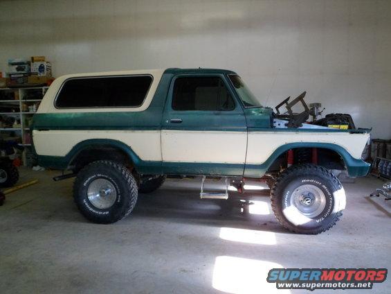 1978 Ford Bronco with two-tone paint, lifted suspension, and hood open