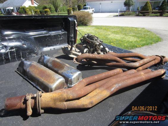Engine manifold and valve covers in truck bed