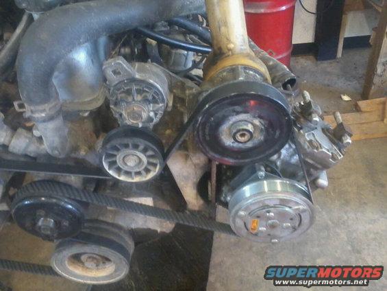 photo005.jpg york compressor with a serp. belt clutch put on it.  and a custom made (by me) bracket that mounts it in place of the factory a/c compressor