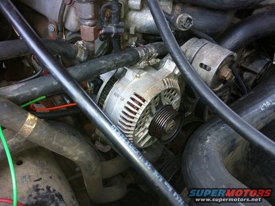 Alternator installed after notching the bracket rib to fit.