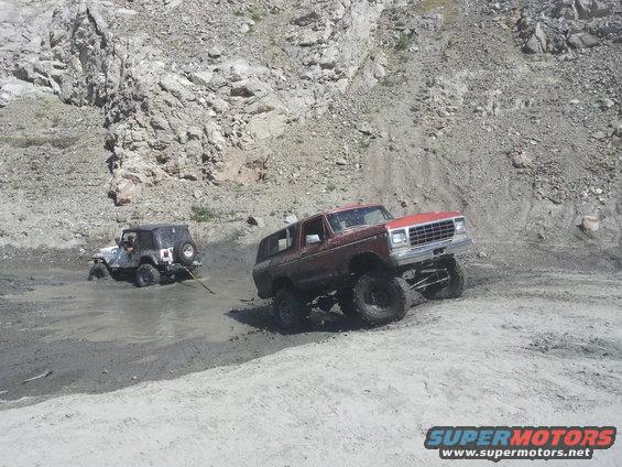 Red 1978 Ford Bronco with lifted suspension