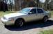 2004 Mercury Grand Marquis - Side view of a silver Mercury Grand Marquis sedan parked outdoors.