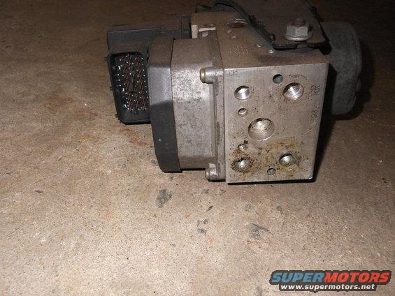 ABS module with large electrical connector and metal hydraulic ports