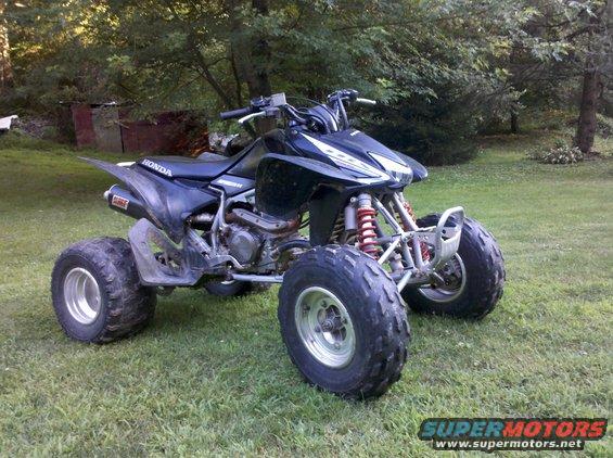 Black 2005 Honda TRX 450 R quad bike parked on grass