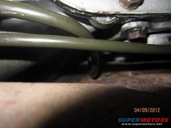 Transmission lines above exhaust pipe with date stamp 04/09/2012