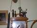 1993 Ford Bronco - A decorative clock features a mounted deer head, duck calls, and a shotgun shell, alongside a framed picture of a deer.