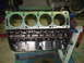 1957 Ford Custom Sedan - Engine block on a stand, ready for assembly or rebuild. Part number 045F-B is visible on the side.