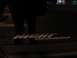 2007 Dodge Durango - Emblem reads 'Night Runner' on a dark surface, possibly a vehicle part.
