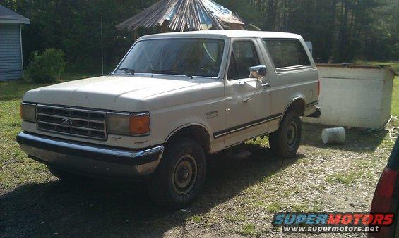 1987 Ford Bronco parked outdoors on a gravelly surface