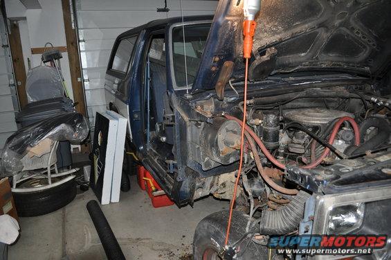 1986 Ford Bronco engine bay with hood open, showing engine components and wiring
