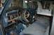 1986 Ford Bronco - The dashboard gauges and wood grain trim are visible in this interior shot of a truck or SUV.