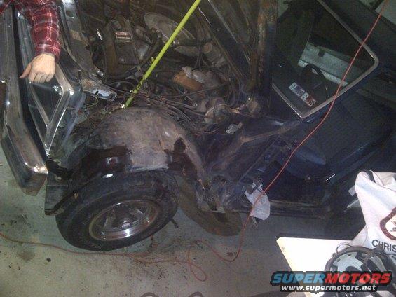 1986 Ford Bronco engine bay with front fender removed, showing engine components and wiring