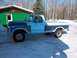 1978 Ford F-250 - Side view of a 1978 Ford F-250 pickup truck with a two-tone paint scheme, parked outdoors in a snowy environment.
