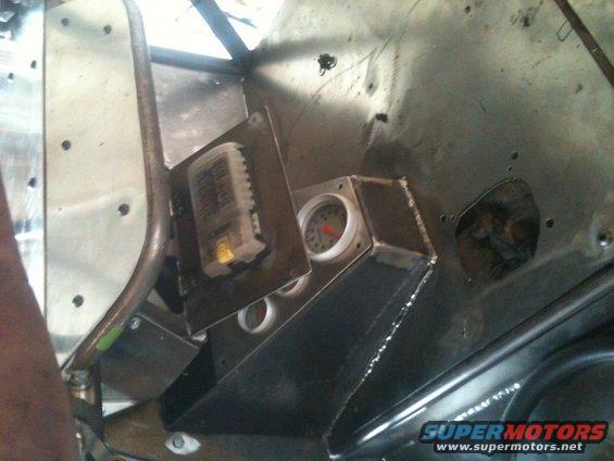 Interior dashboard with gauges and fuse box