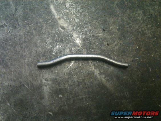 Bent metal rod on textured surface