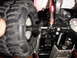1993 Ford Bronco - Detail of a remote control car's chassis and tire, a visible "SUPERMOTORS" logo.