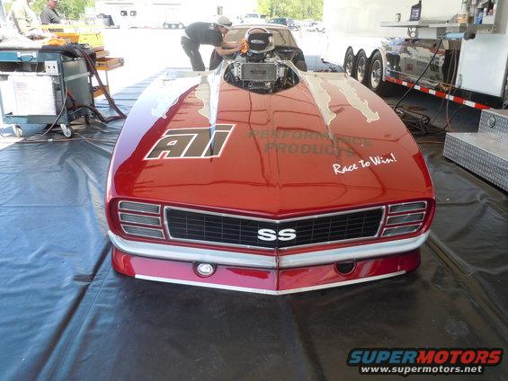 red drag car with SS badge on grille, ATI logo on hood, and 'Race to Win!' text