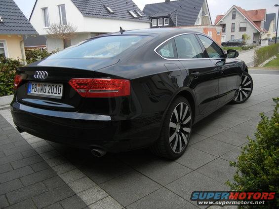 Black Audi A5 Sportback rear 3/4 view. License plate PB WG 2010