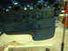 1957 Ford Custom Sedan - Close-up of a blue painted engine block, likely undergoing restoration or repair.