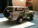 1979 Ford Bronco - This model Bronco features a white body with green accents and a rear-mounted spare tire.