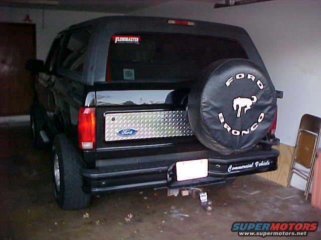 Rear of a 1995 Ford Bronco with a spare tire cover and a Ford emblem on the tailgate