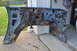 1986 Ford Bronco - A heavily rusted blue fender and inner wheel well structure is shown, with no discernible year or vehicle identification.