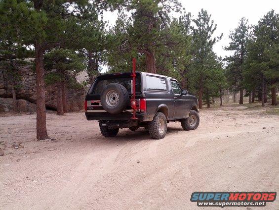 Black 1994 Ford Bronco rear view with spare tire on tailgate