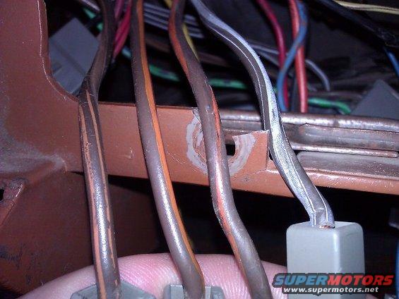 close-up of a vehicle's wiring harness with several colored wires