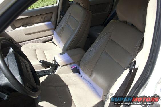 Interior view of car seats, dashboard, and steering wheel
