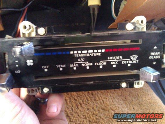 Interior climate control panel with temperature and fan speed sliders