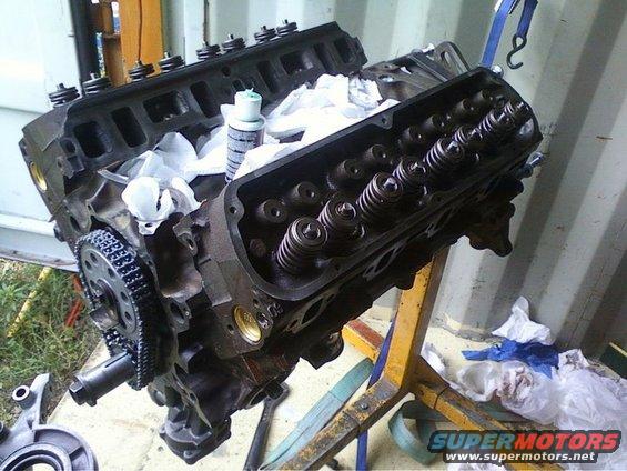 Engine block with valve train exposed, on an engine stand