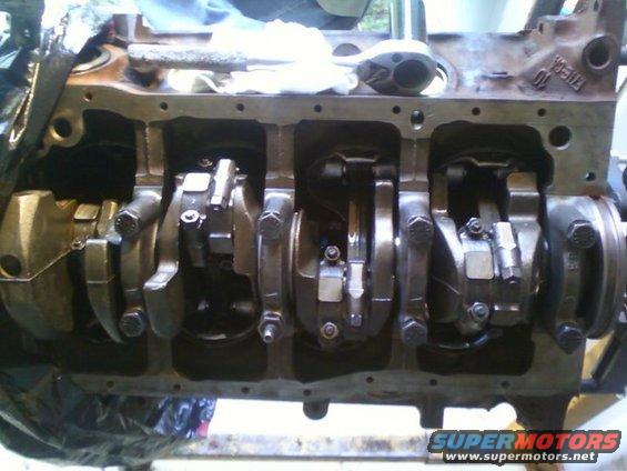 Engine block with crankshaft and connecting rods visible