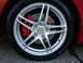 1996 Ford Probe - Aftermarket wheel and red brake caliper shown on a vehicle.