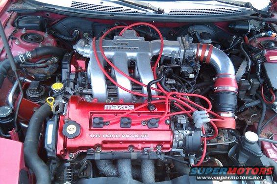 Mazda V6 DOHC 24-valve engine with red spark plug wires