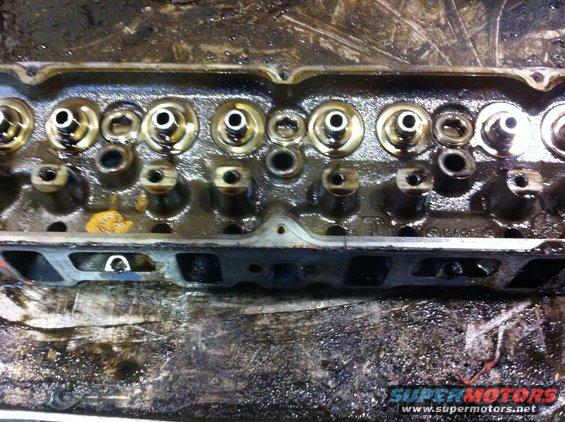 Engine cylinder head with valves and springs