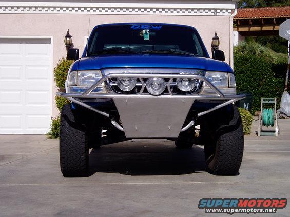 Blue 1998 Ford Ranger front view with custom bumper and off-road tires