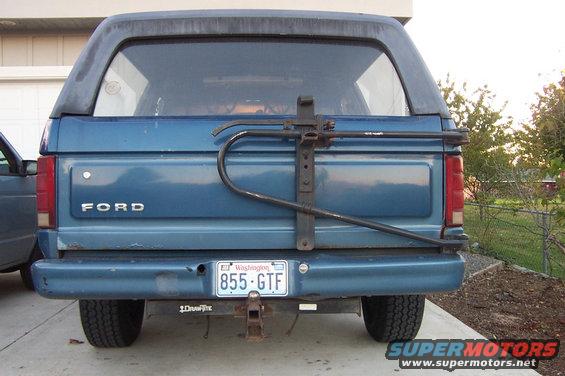 Blue Ford Bronco rear view with spare tire carrier and Washington license plate