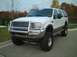 2000 Ford Excursion - White 2000 Ford Excursion modified with a brush guard and lifted suspension.
